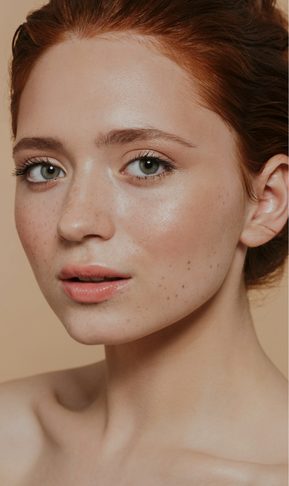 Close up of a woman with fair skin and red hair